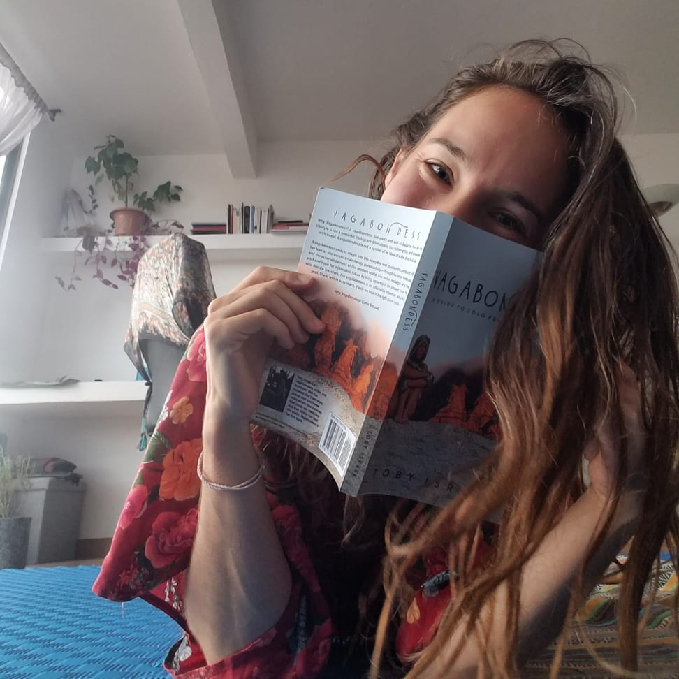 Toby Israel holding Vagabondess — candid author portrait